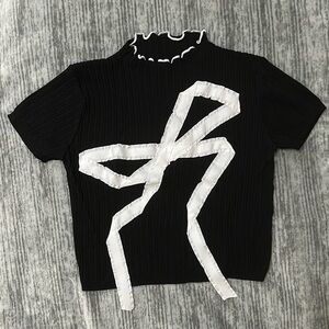 Black Top with White Bow Design